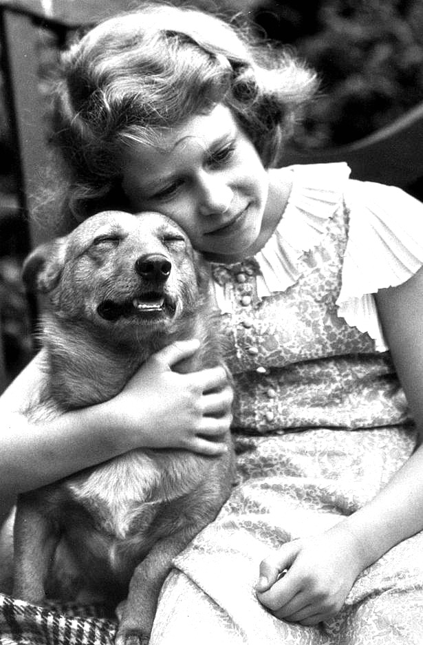 princess-elizabeth-hugging-a-corgi-dog-in-july-1936